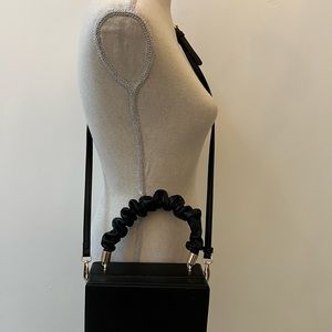 Great little bag! Black faux leather box bag with gathered handle,crossbody too!